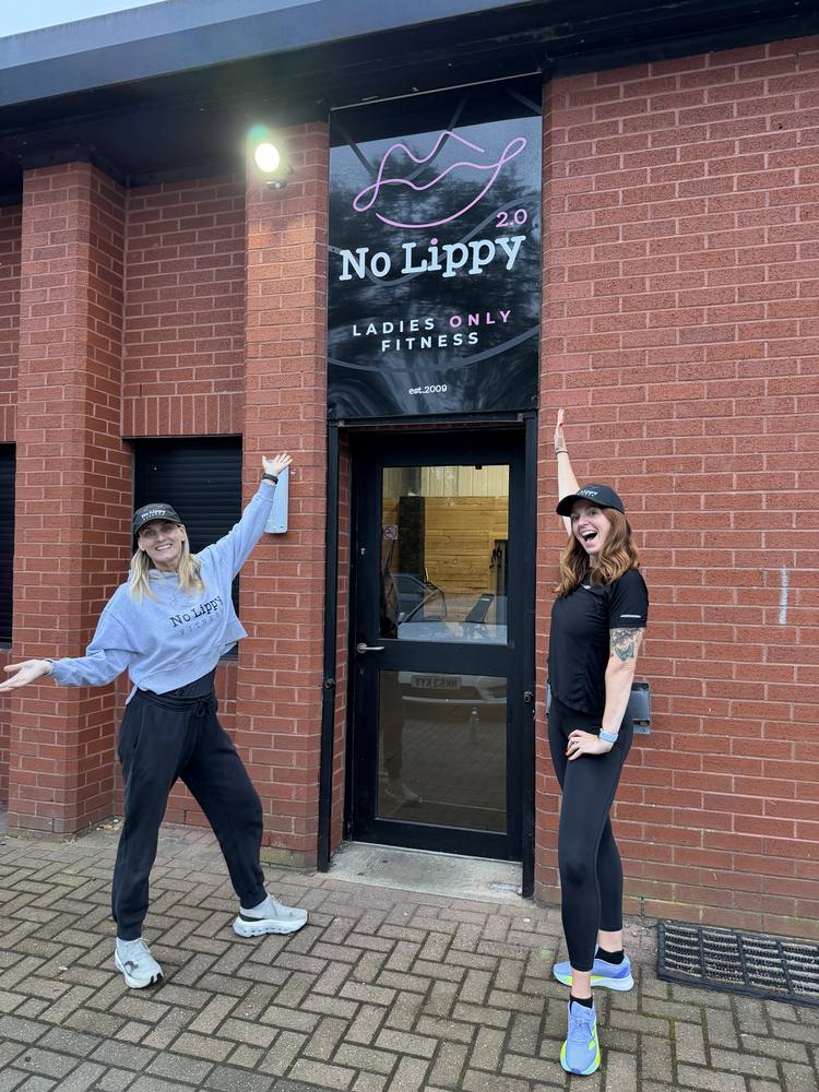 Donna and Ashleigh outside the entrance to No Lippy Fitness, under the No Lippy sign
